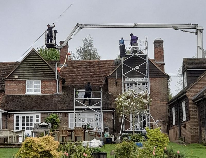 The Roof Moss Cleaners using cherry picker and scaffolding to clean roof safely and professionally in Kidlington, Oxfordshire
